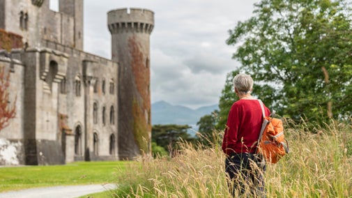 Visitor exploring Penrhyn Castle and Garden, North Wales